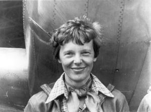 1200px-amelia_earhart_standing_under_nose_of_her_lockheed_model_10-e_electra2c_small